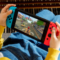 Nintendo Switch -pelikonsoli, neonpunainen ja neonsininen