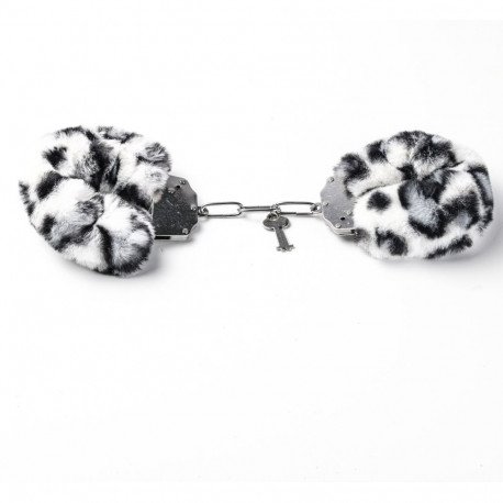 Erootilised metallist käerauad leopardimustriga karvaga, valge-must