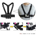 Adjustable harness for a sports camera with a rotating tripod and a phone stand